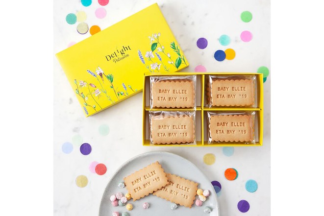 A yellow box of cookies that have messages on them 