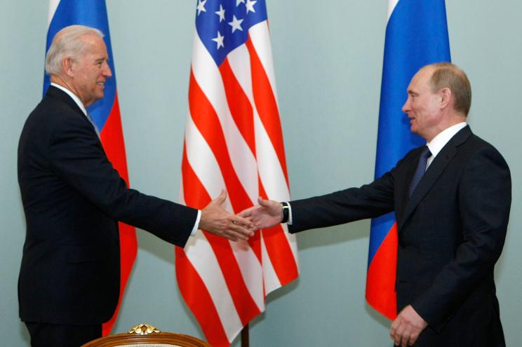 Joe Biden shakes hands with Vladimir Putin during a meeting in Moscow in 2011.