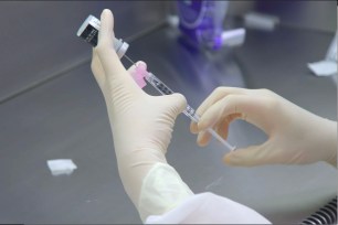 A lab technician during a dry run at Mount Sinai hospital ahead of an expected Pfizer COVID-19 vaccine shipment.