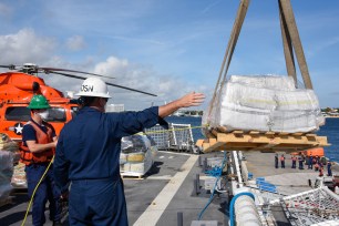 The Coast Guard Cutter James crew offloads approximately 23,000 pounds of cocaine and approximately 8,800 pounds of marijuana, worth more than $411.3 million.