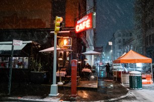 People continue to eat at Fanelli’s Cafe in SoHo despite the city’s order to close at 2pm during the first snow of the season.