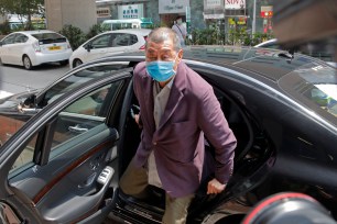 Pro-democracy media tycoon Jimmy Lai arrives at a police station for report in Hong Kong.