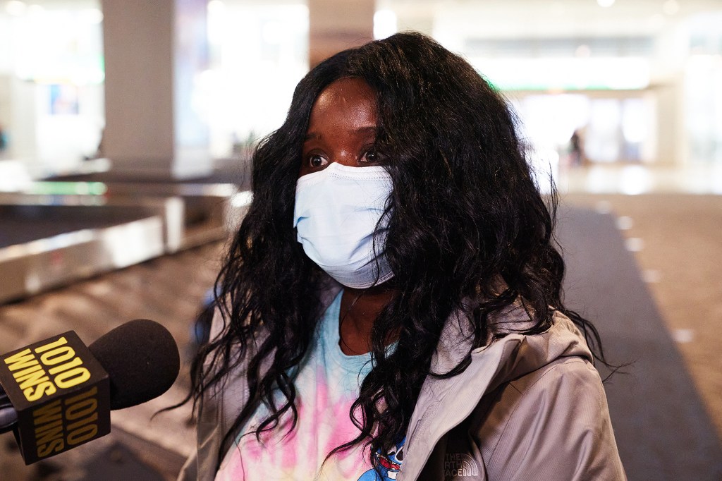 Passenger Fatima Lindsey arrives at LaGuardia Airport today.