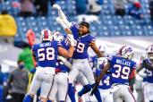 Bills player celebrate after their 27-24 AFC wild-card victory over the Colts,
