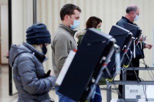 Voters cast their ballots in the US Senate run-off election at a polling station in Marietta, Ga.