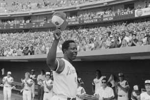 Hank Aaron acknowledges the crowd after hitting his 700th career homer.