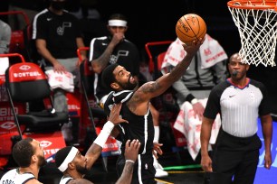 Kyrie Irving goes up for a shot during the Nets' 130-96 win over the Jazz.