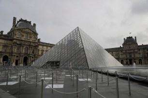 The empty courtyard of the Louvre museum is pictured.