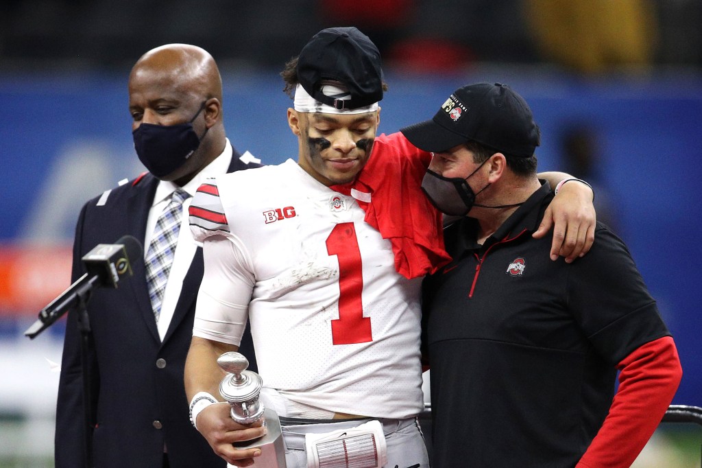 Ryan Day celebrates with quarterback Justin Field after Ohio State's win over Clemson.