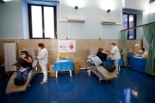 Medical staff is vaccinated against COVID-19 at a Rome hospital