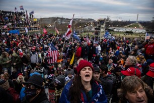 Thousands of pro-Trump supporters storm the Capitol Building after attending a Trump rally.
