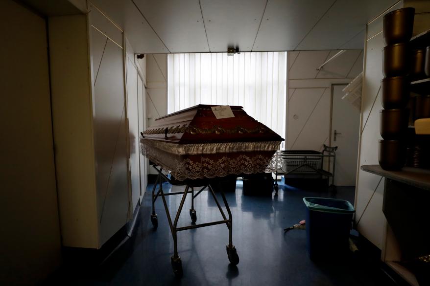 A casket is placed in a hallway at a crematorium in Ostrava, Czech Republic, Thursday, Jan. 7, 2021.