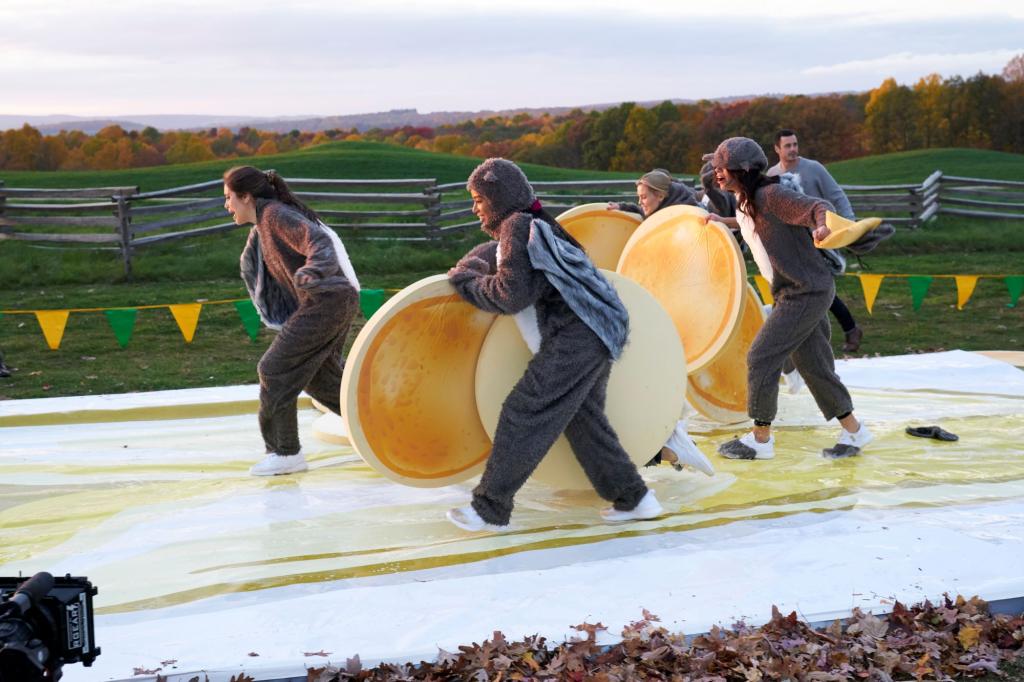 The women compete a fall themed obstacle course