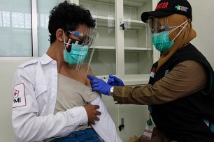 volunteers take part during a Coronavirus COVID-19 vaccination simulation in Bogor, West Java, Indonesia