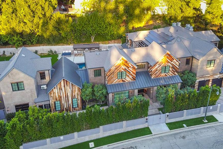 Kelly Clarkson is re-listing her Encino home for $9M amid custody battle.