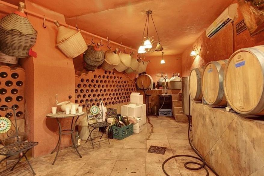 The wine cellar is pictured. Classic Italian touches are prevalent throughout the house — for instance, one bathroom is inscribed “Bagnon,” which means “bathroom” in Italian.