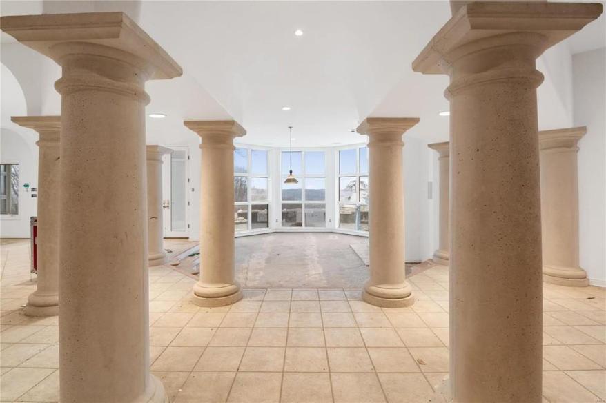 The property has an open floor plan with sky-high ceilings.