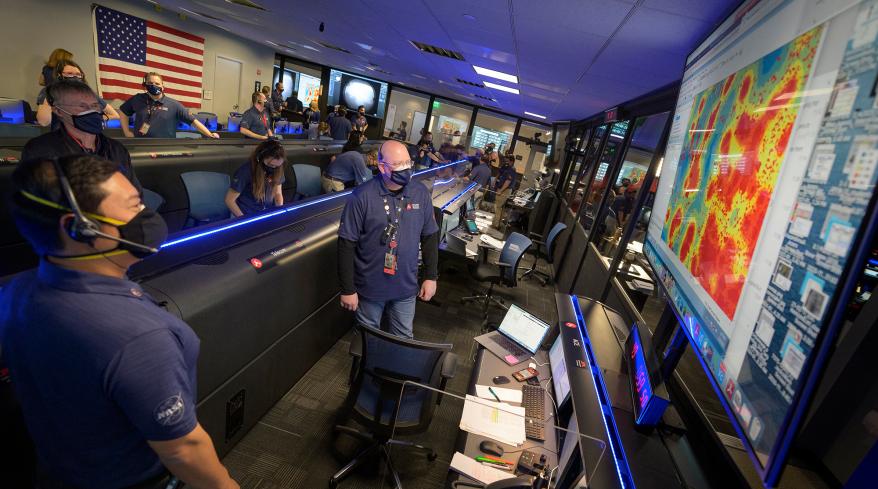 Members of NASA's Perseverance rover team react in mission control after receiving confirmation the spacecraft successfully touched down on Mars.