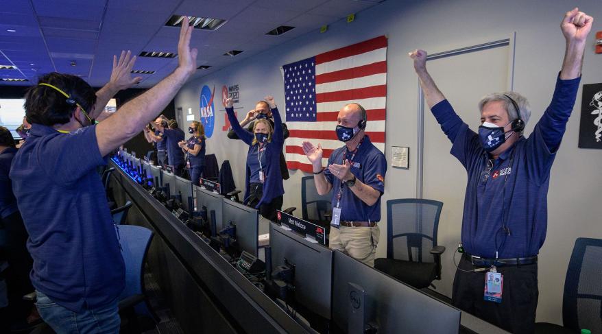 Members of NASA's Perseverance rover team react in mission control after receiving confirmation the spacecraft successfully touched down on Mars.