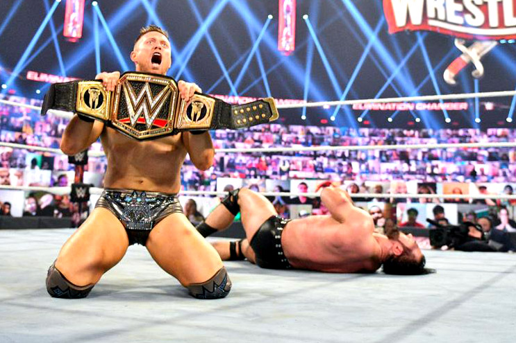 The Miz celebrates winning the WWE championship from Drew McIntyre at Elimination Chamber on Feb. 20, 2021