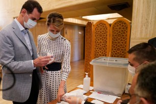 Bashar Assad, left, and his wife Asma voting at a polling station in the parliamentary elections, in Damascus, Syria.