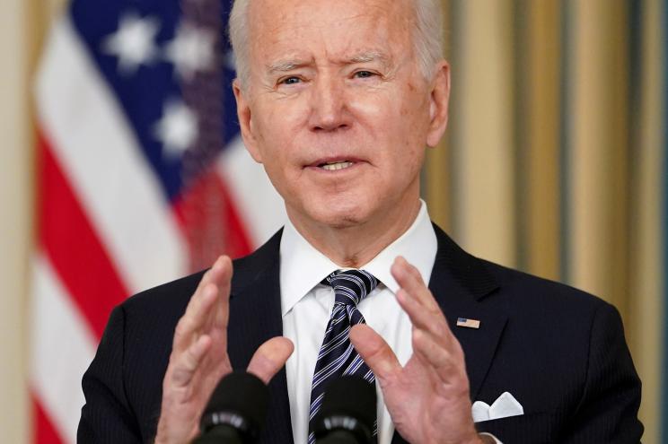 President Joe Biden speaks about the implementation of the American Rescue Plan in the State Dining Room at the White House on March 15, 2021.