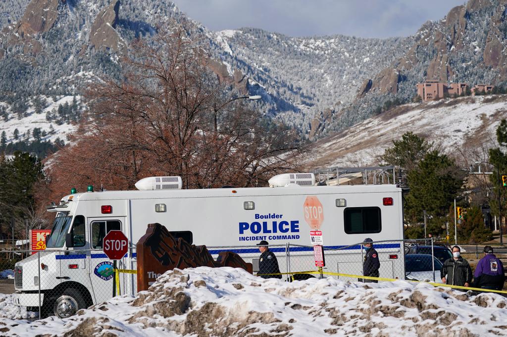 Police head into the parking lot outside the King Soopers grocery store in Boulder, Colo., on March 23.
