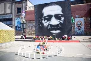 An altar for George Floyd is erected where Floyd was killed.