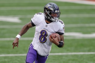 Lamar Jackson scrambles in a 2020 game against the Cincinnati Bengals.