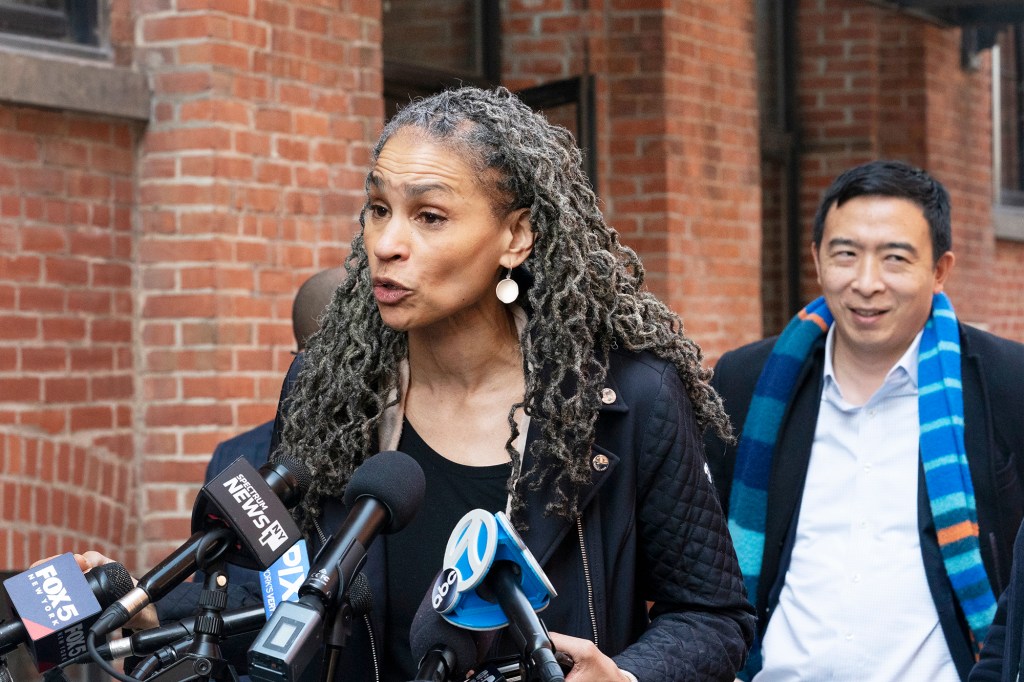 Democratic mayoral candidate Maya Wiley speaks at a news conference while her opponent Andrew Yang, right, listens on March 11, 2021.