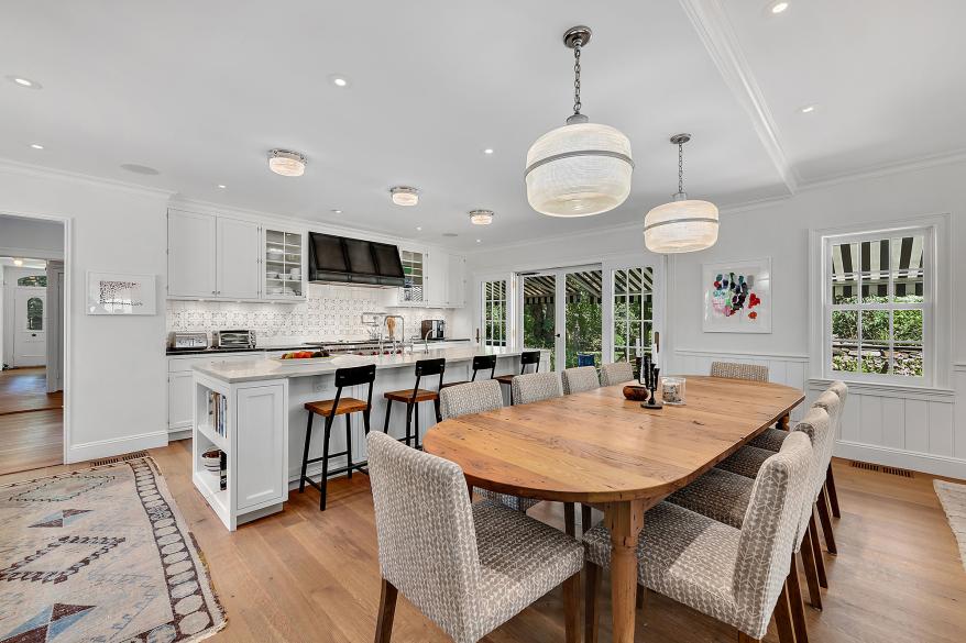 The kitchen features plenty of eat-in seating space.