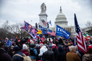 Thousands of pro-Trump supporters storm the Capitol Building after attending a Trump rally
