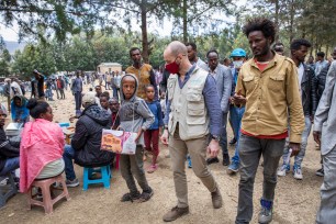 Manuel Fontaine, UNICEF Director of the Office of Emergency Programmes, center, visits internally-displaced people in Adigrat Town, in the Tigray region of northern Ethiopia Monday, Feb. 22, 2021.