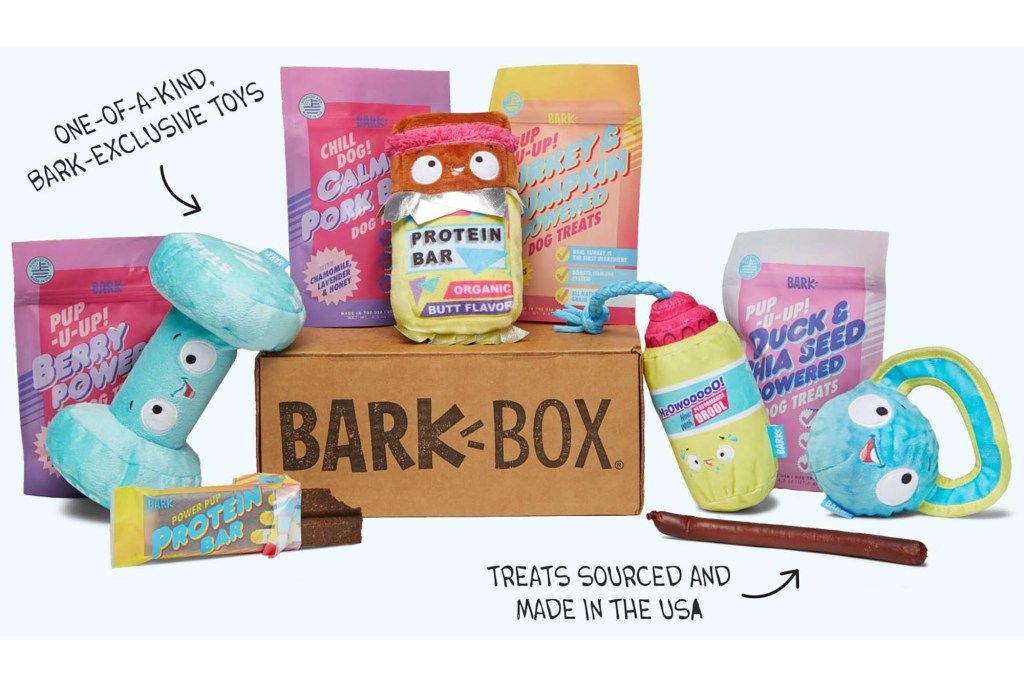 An array of dog toys and treats in a box 