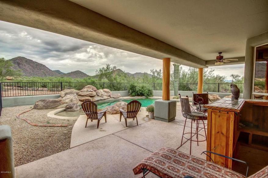 The five-bedroom, four-bathroom pueblo-style home spans 3,700-square-feet on 2.2 desert acres.