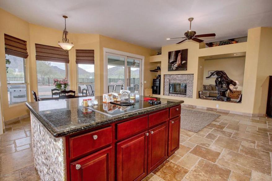 Inside, the house has several fireplaces, exposed wooden ceiling beams, tiled floors, arched doorways and luxurious finishes.