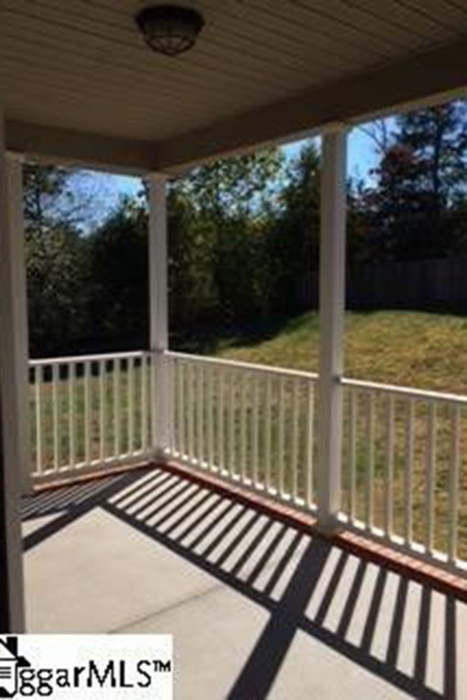 A covered back porch overlooks the half-acre lot at the end of a cul-de-sac.