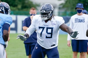 Tennessee Titans offensive tackle Isaiah Wilson (79) runs a drill during
