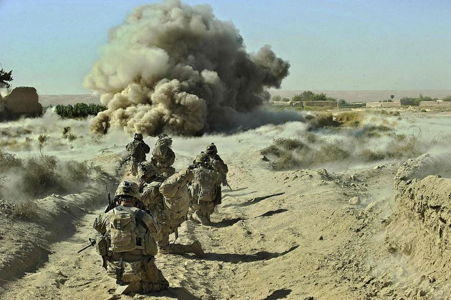 US Army soldiers detonate IED’s on a nearby road during a dawn operation at Naja-bien village on September 23, 2012.