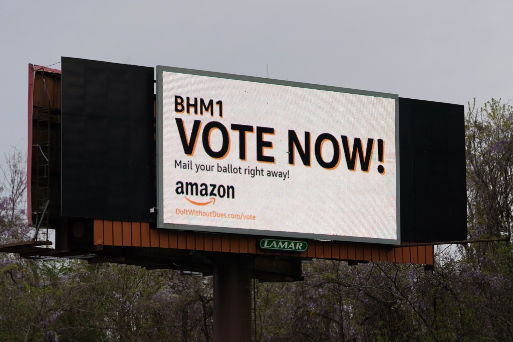 An Amazon-sponsored billboard urging employees to return their unionization ballots is seen on March 28 in Bessemer, Alabama.