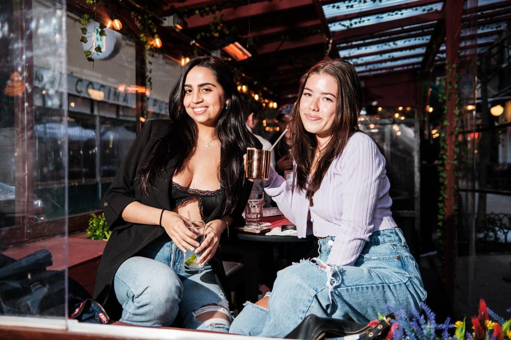 Juliana Mora, 23, left, and Olivia Brewer, 23 right, at The Red Lion in Greenwich Village in Manhattan. Post vaccination singles are ready to enter the dating scene for a wild summer.