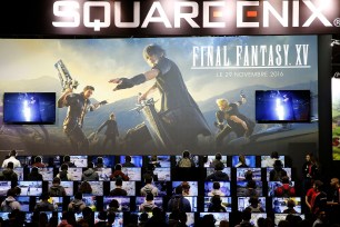 Gamers play Square Enix's "Final Fantasy XV" at a 2016 gaming trade fair event in Paris.