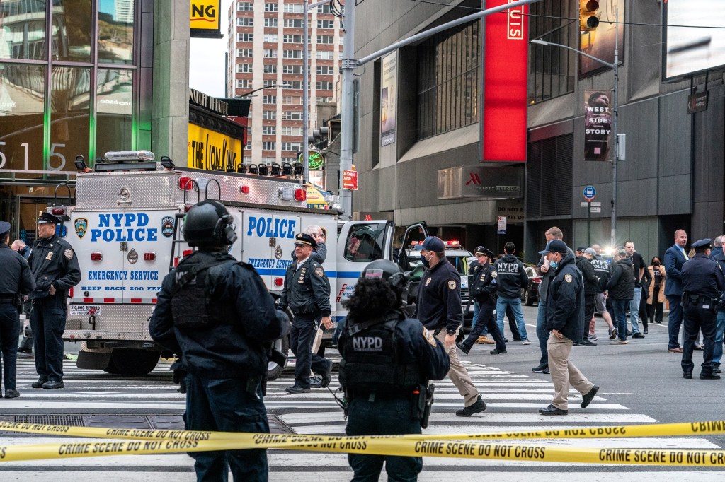 NYPD officers stand guard after a shooting incident in Times Square on May 8, 2021.