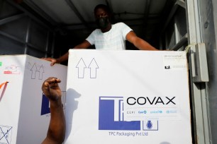 Boxes of AstraZeneca/Oxford coronavirus vaccines, redeployed from the Democratic Republic of Congo, arrive at a cold storage facility in Accra, Ghana, May 7, 2021.