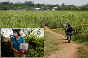 Police officers secure the perimeter of the site where the authorities are excavating a clandestine cemetery discovered at the house of a former police officer and containing many bodies, most of them believed to be women in Chalchuapa, El Salvador.