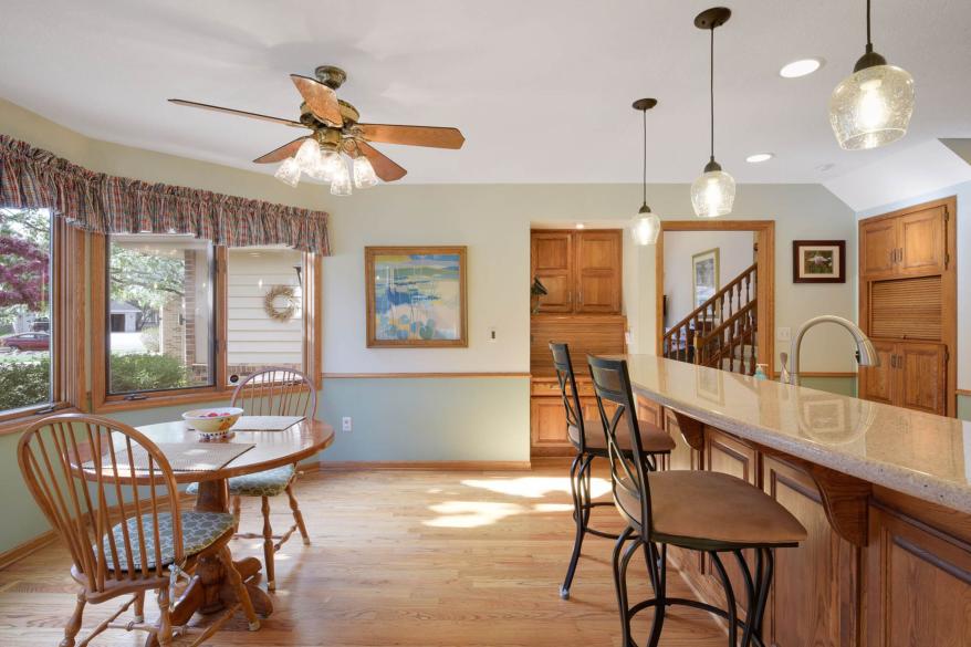 Both the breakfast bar and the breakfast nook can be seen in this photo.
