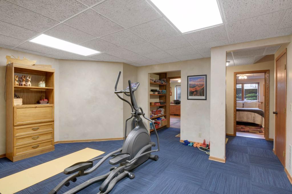This room with blue floors is being used as a gym.