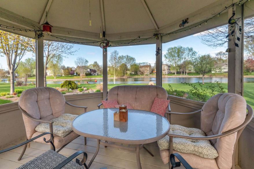 Inside the gazebo is a sitting area.