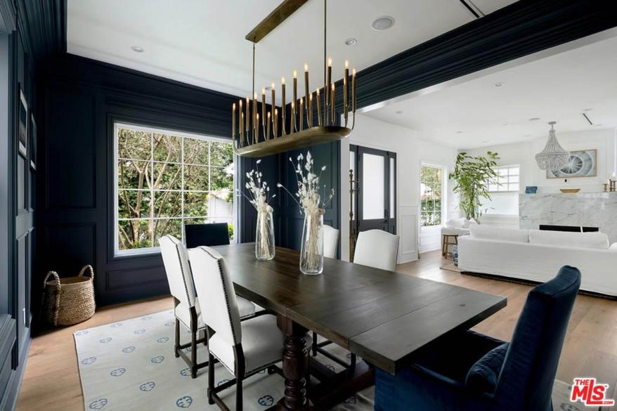 The formal dining room painted a chic shade of charcoal.