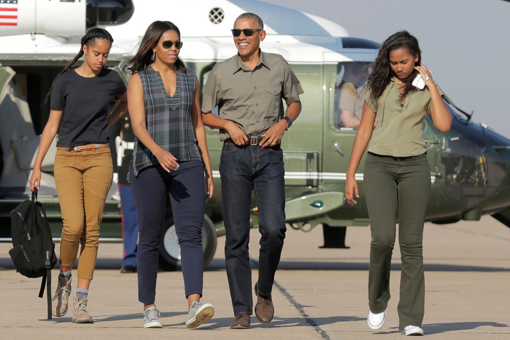 Then-President Barack Obama and first lady Michelle Obama with their daughters Malia (left) and Sasha (right) in 2016.